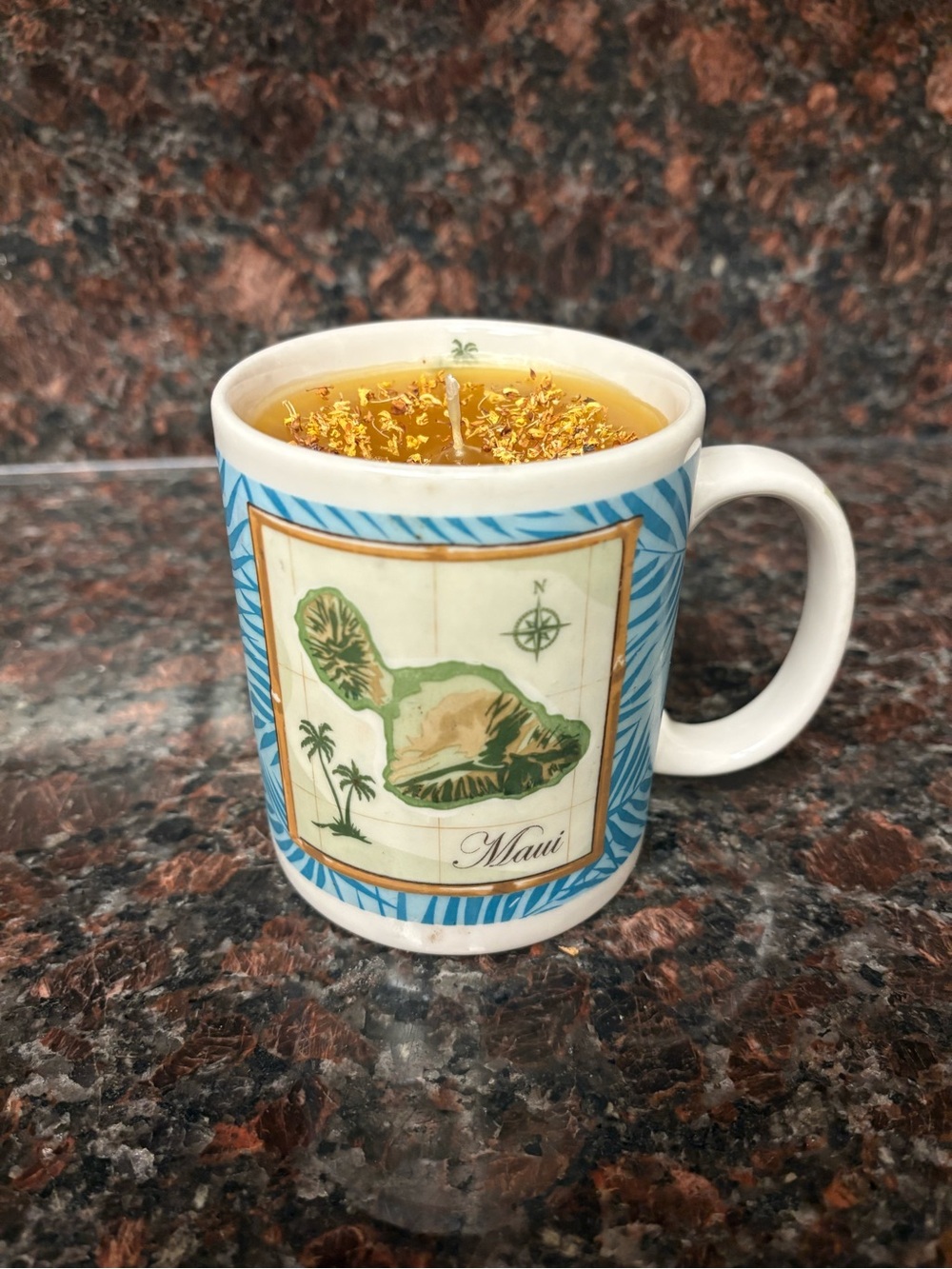 Upcycled Maui Hawaii mug candle pineapple scented with yellow flowers on top